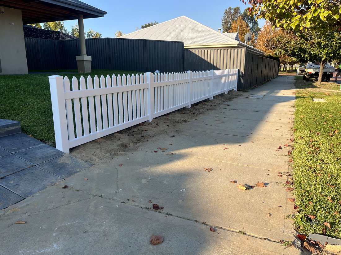 White New England style picket fence along a driveway, Ellenbrook WA